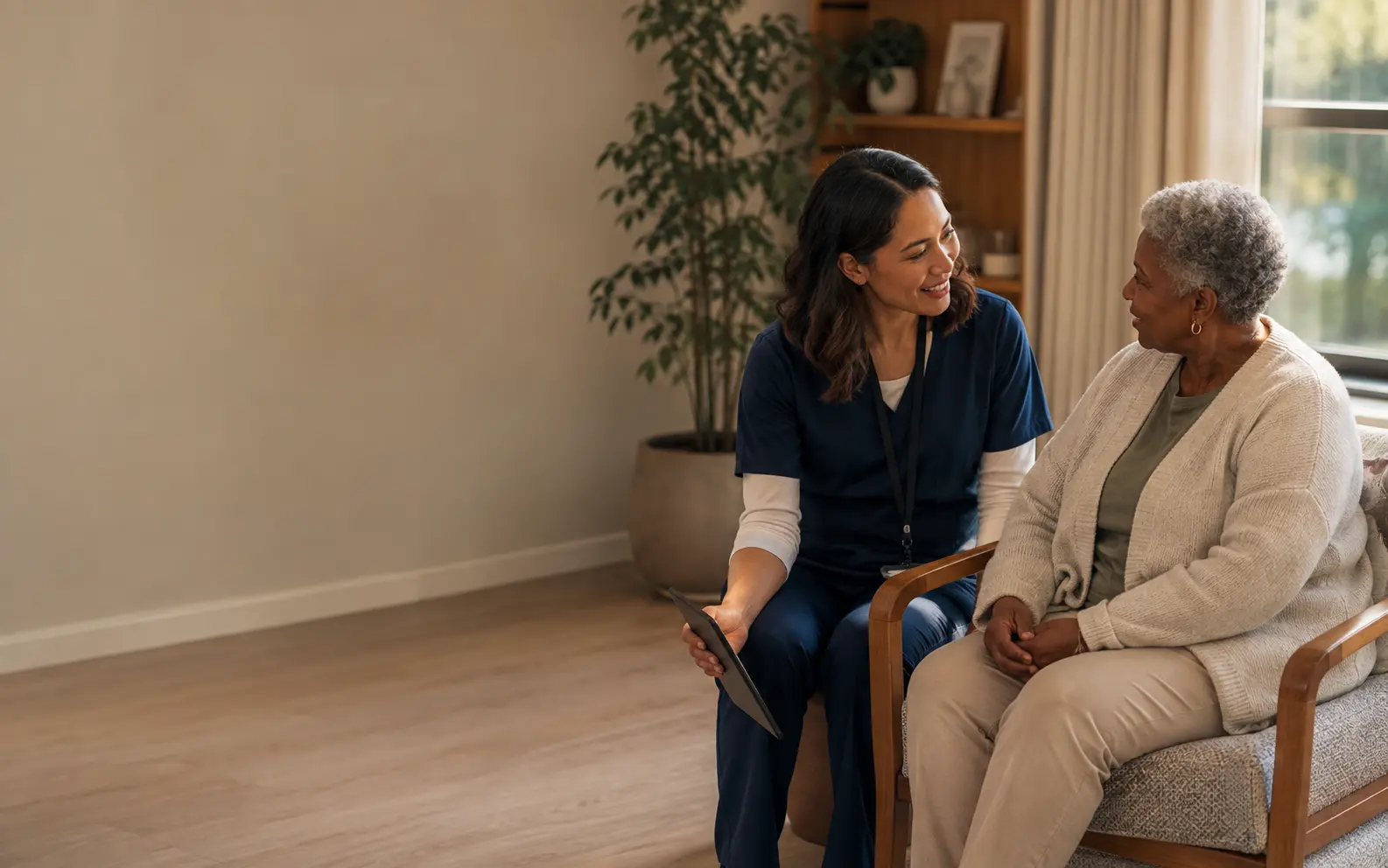 A clinician speaking with an older resident